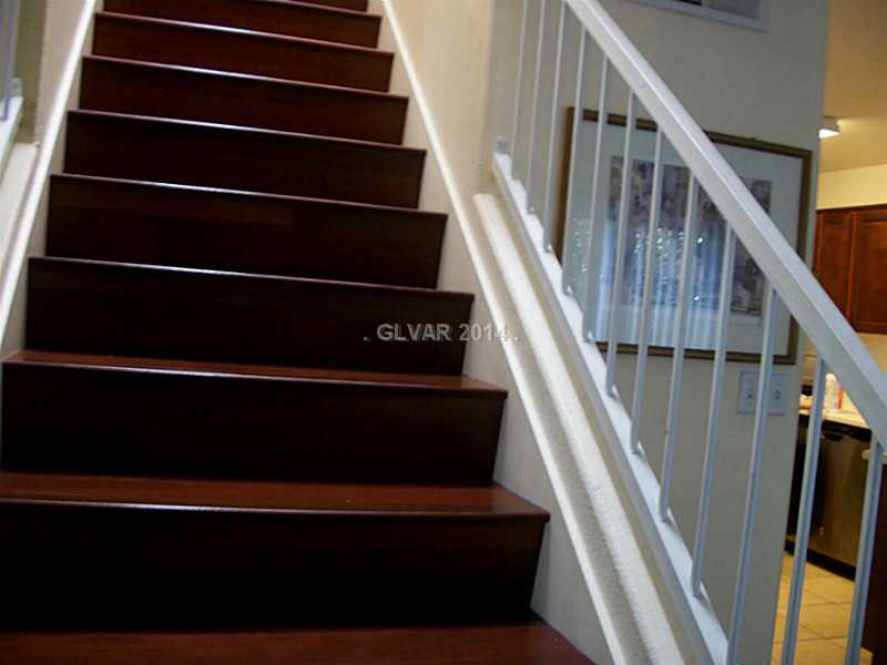 10189 Quaint Tree Street Las Vegas, NV 89183 - Photo 10 of 22 Property Photo. Beautiful staircase to second floor