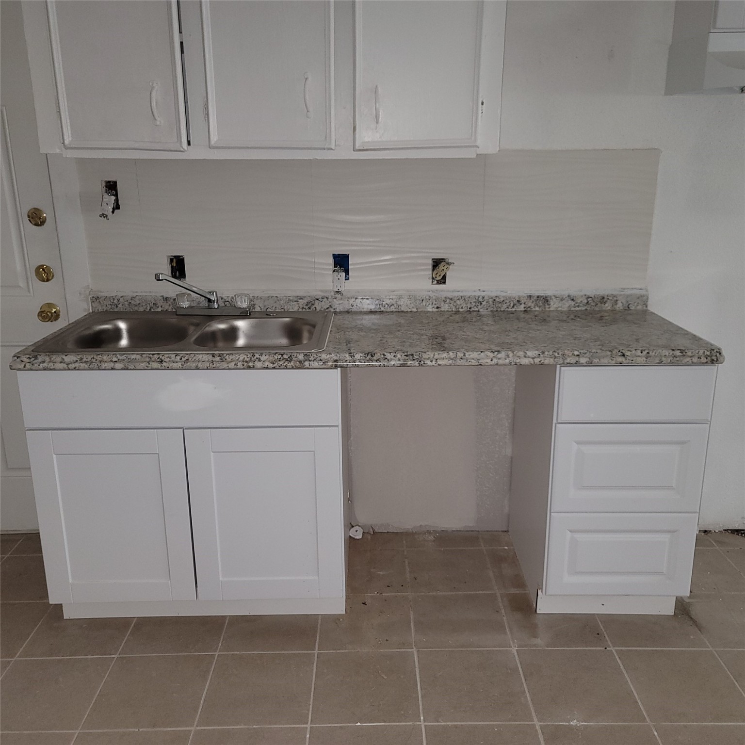3823 Lydia Street, Unit 2 Houston, TX 77021 - Photo 11 of 13 a kitchen with a sink cabinets and utility