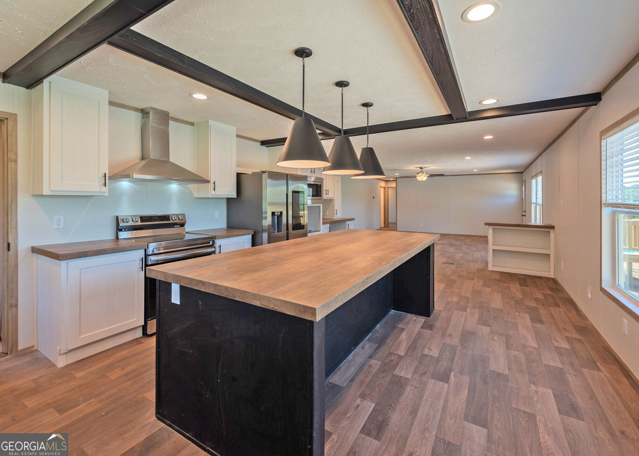 413 Griffin Road Martin, GA 30557 - Photo 7 of 31 a kitchen with stainless steel appliances kitchen island a large island in the center