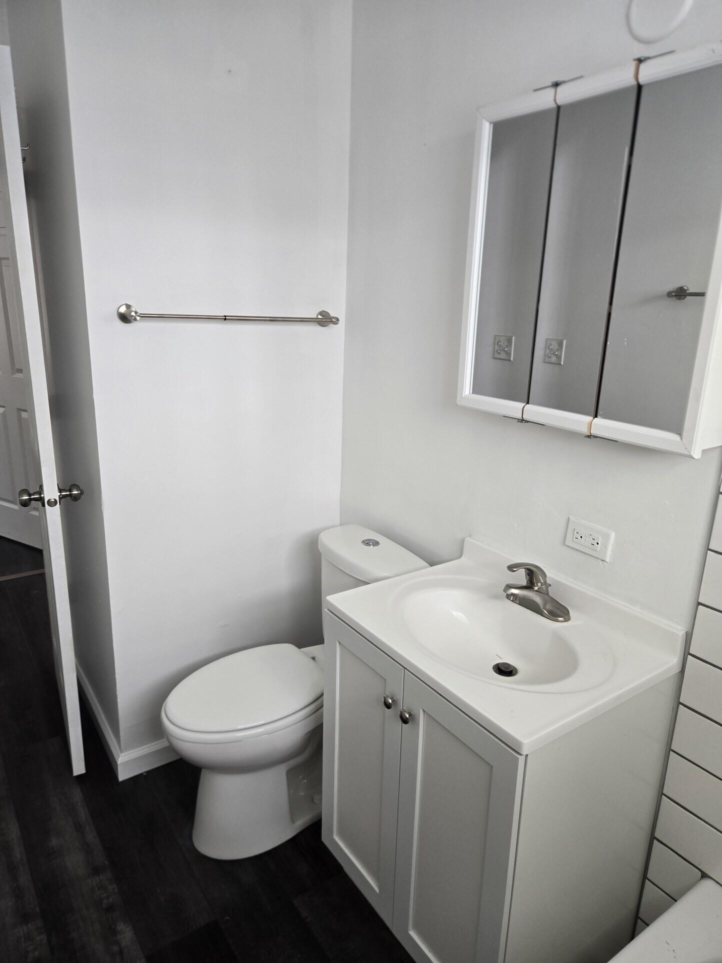 1932 Arthur Street Gary, IN 46404 - Photo 13 of 14 a white toilet sitting next to a bathroom sink