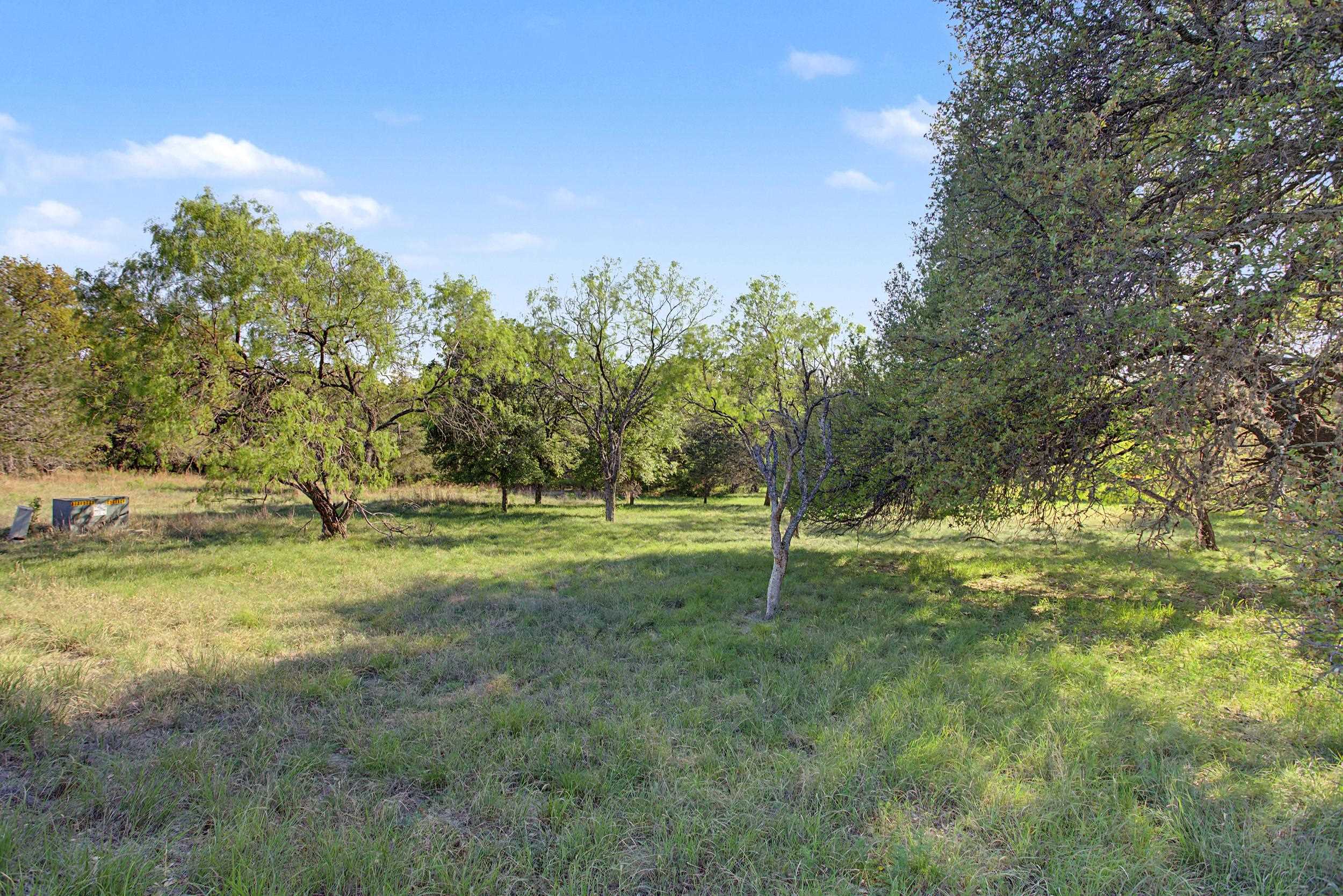 Fault Line Horseshoe Bay, TX 78657 - Photo 7 of 26 a view of a field with trees in the background