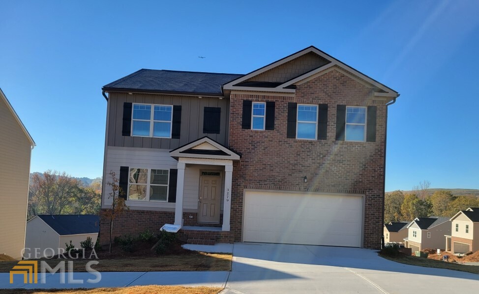 3279 Loblolly Pine Way, Unit 114 Decatur, GA 30034 - Photo 1 of 1 a front view of a house with a yard