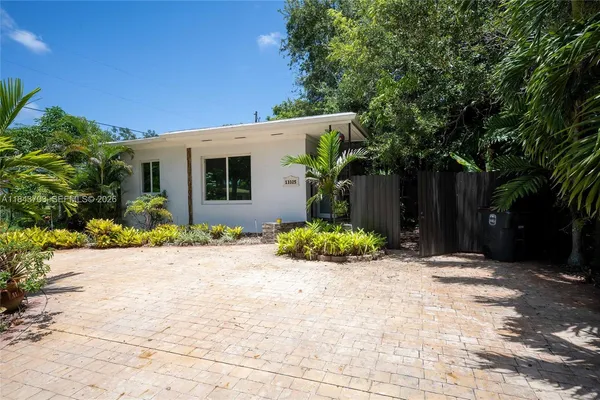 a view of house with yard and outdoor space