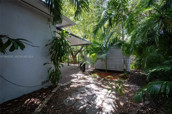 a backyard of a house with lots of green space