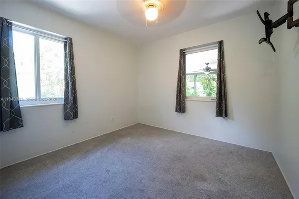 an empty room with windows