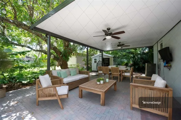 a outdoor space with patio the couches and a potted plant with the view of garden