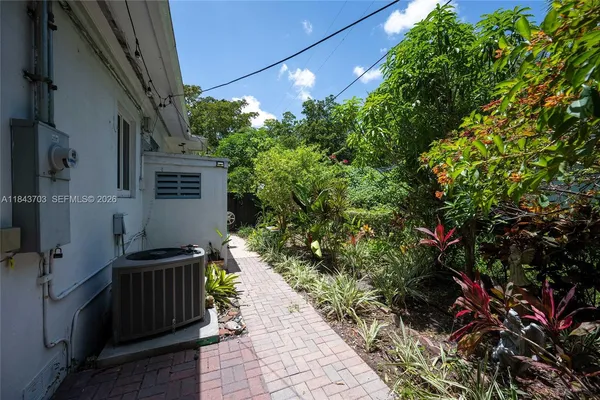 a backyard of a house with lots of green space