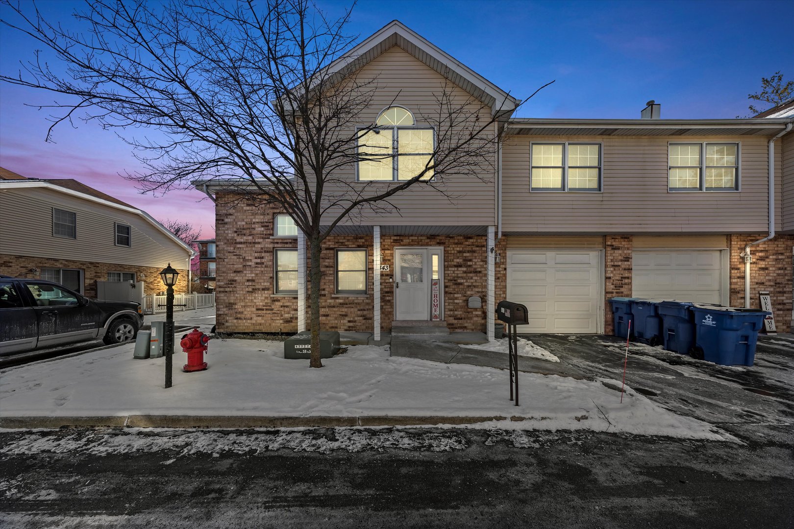 4343 West Emerald Way Street Alsip, IL 60803 - Photo 2 of 44 a front view of a house with garden