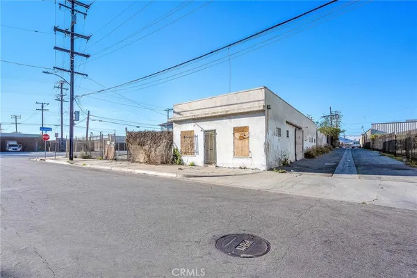 a view of a house with a road