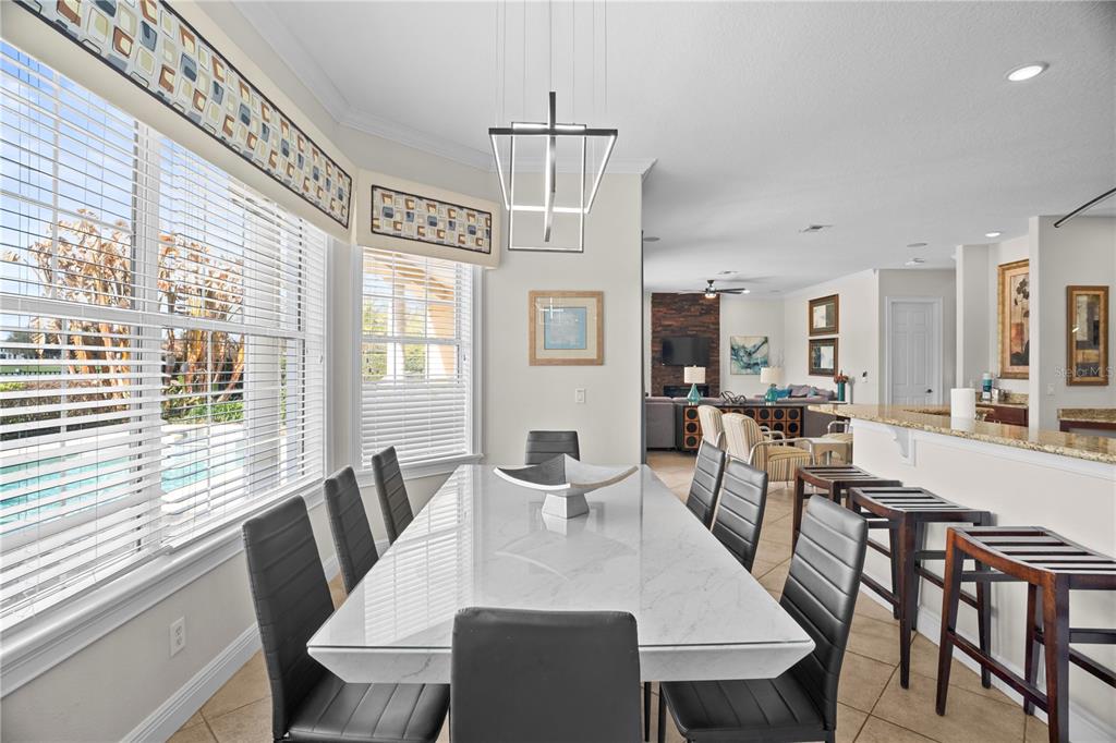 7388 Gathering Court Reunion, FL 34747 - Photo 13 of 56 a view of a dining room with furniture window and outside view
