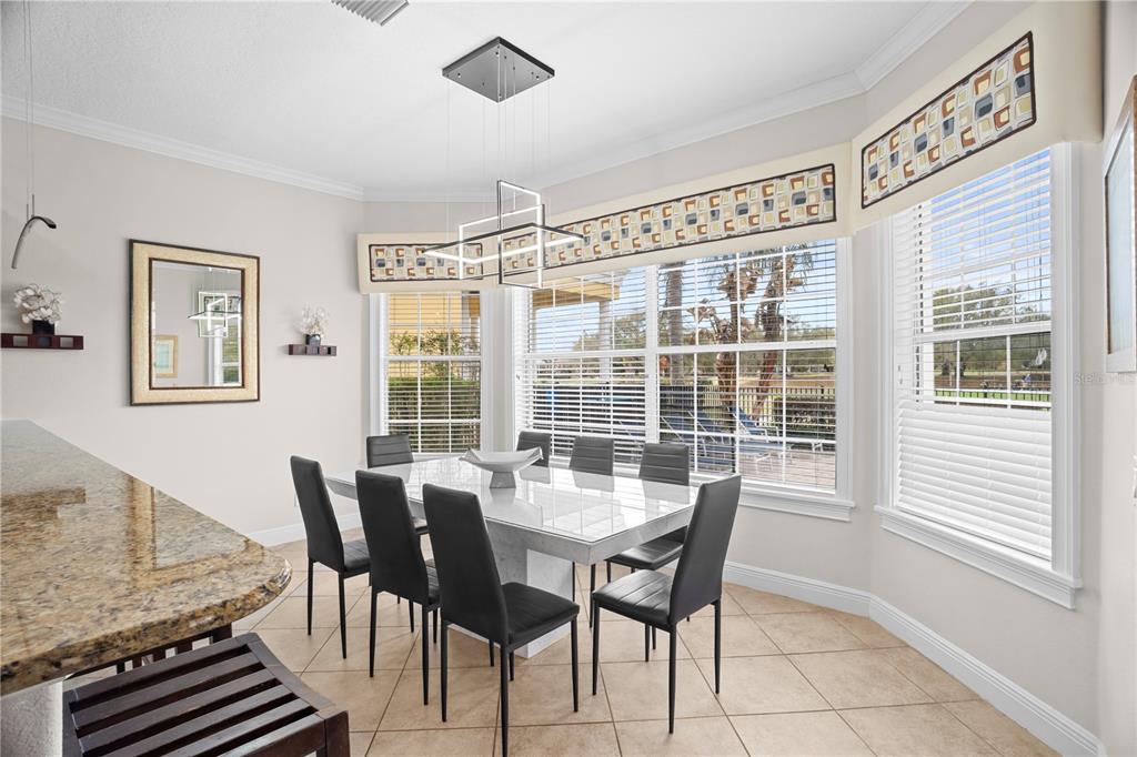 7388 Gathering Court Reunion, FL 34747 - Photo 14 of 56 a dining room with furniture and window