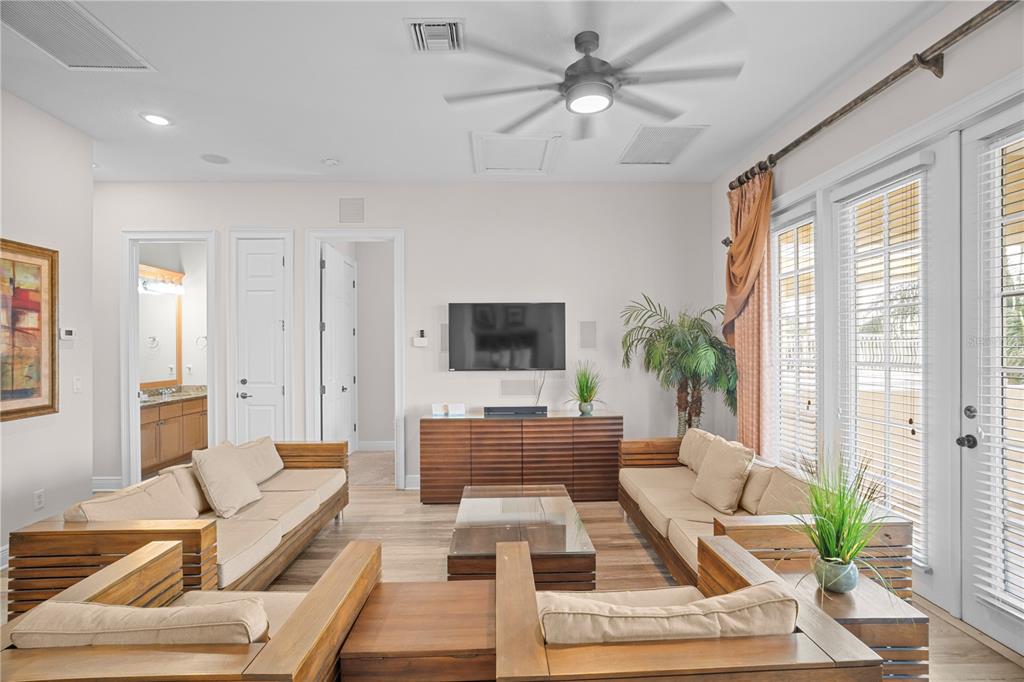 7388 Gathering Court Reunion, FL 34747 - Photo 21 of 56 a living room with furniture and a flat screen tv