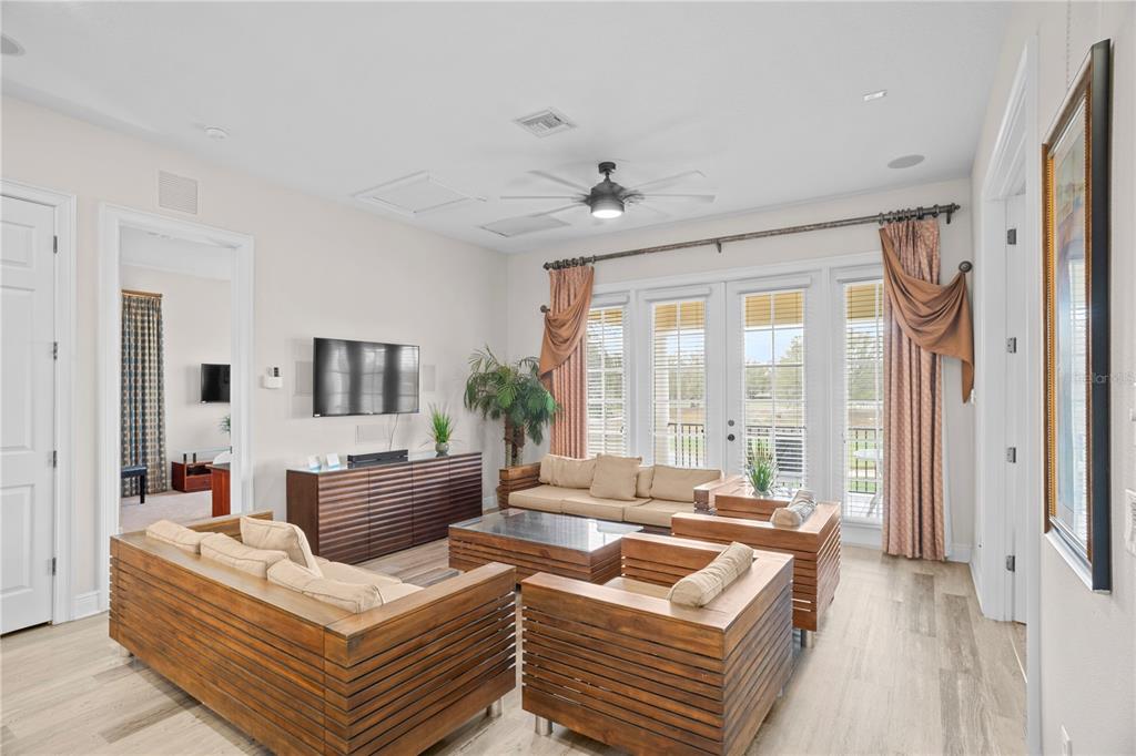 7388 Gathering Court Reunion, FL 34747 - Photo 22 of 56 a living room with furniture and a large window