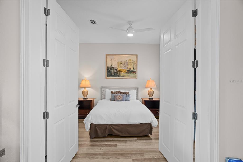 7388 Gathering Court Reunion, FL 34747 - Photo 33 of 56 a bedroom with a bed and a painting on the wall