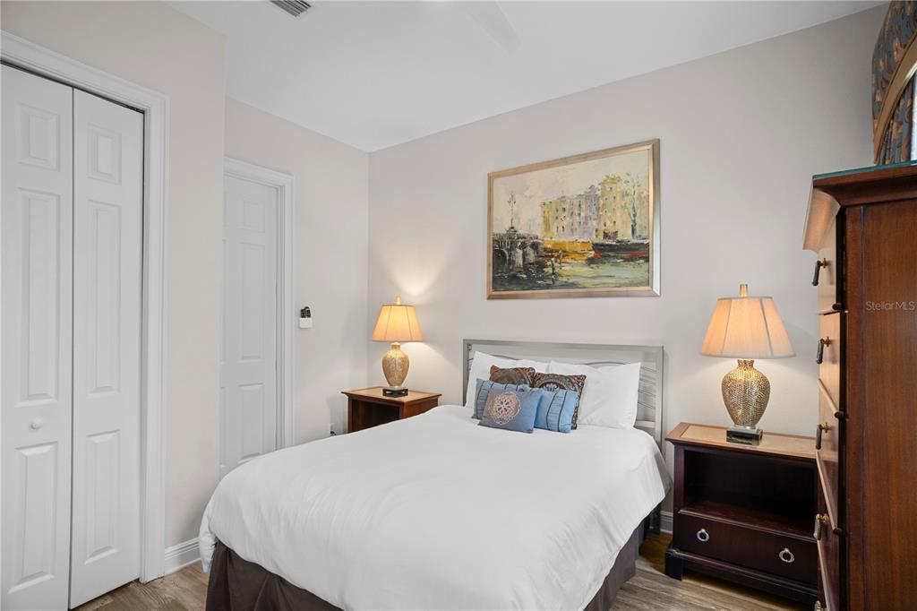 7388 Gathering Court Reunion, FL 34747 - Photo 35 of 56 a bedroom with bed and wooden floor