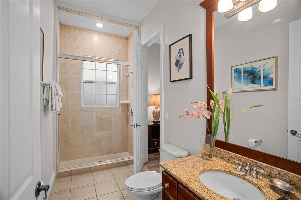 7388 Gathering Court Reunion, FL 34747 - Photo 36 of 56 a bathroom with a sink a toilet and shower
