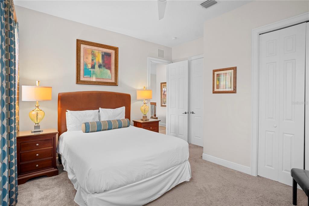 7388 Gathering Court Reunion, FL 34747 - Photo 37 of 56 a bedroom with a bed and a painting on the wall