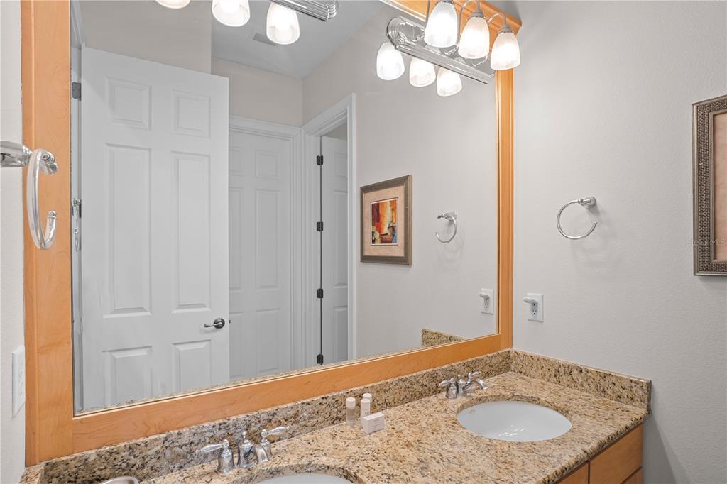 7388 Gathering Court Reunion, FL 34747 - Photo 40 of 56 a bathroom with a sink and a mirror