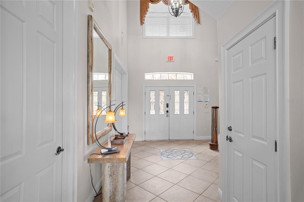 7388 Gathering Court Reunion, FL 34747 - Photo 4 of 56 a view of an entryway with wooden floor