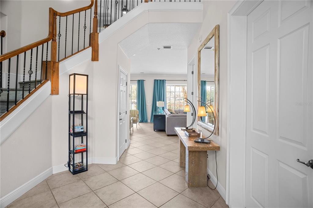 7388 Gathering Court Reunion, FL 34747 - Photo 5 of 56 a view of an entryway with wooden floor