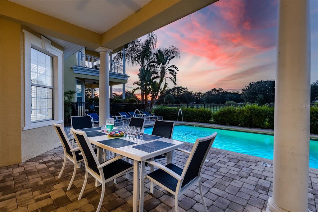 7388 Gathering Court Reunion, FL 34747 - Photo 54 of 56 a view of a backyard with table and chairs and potted plants