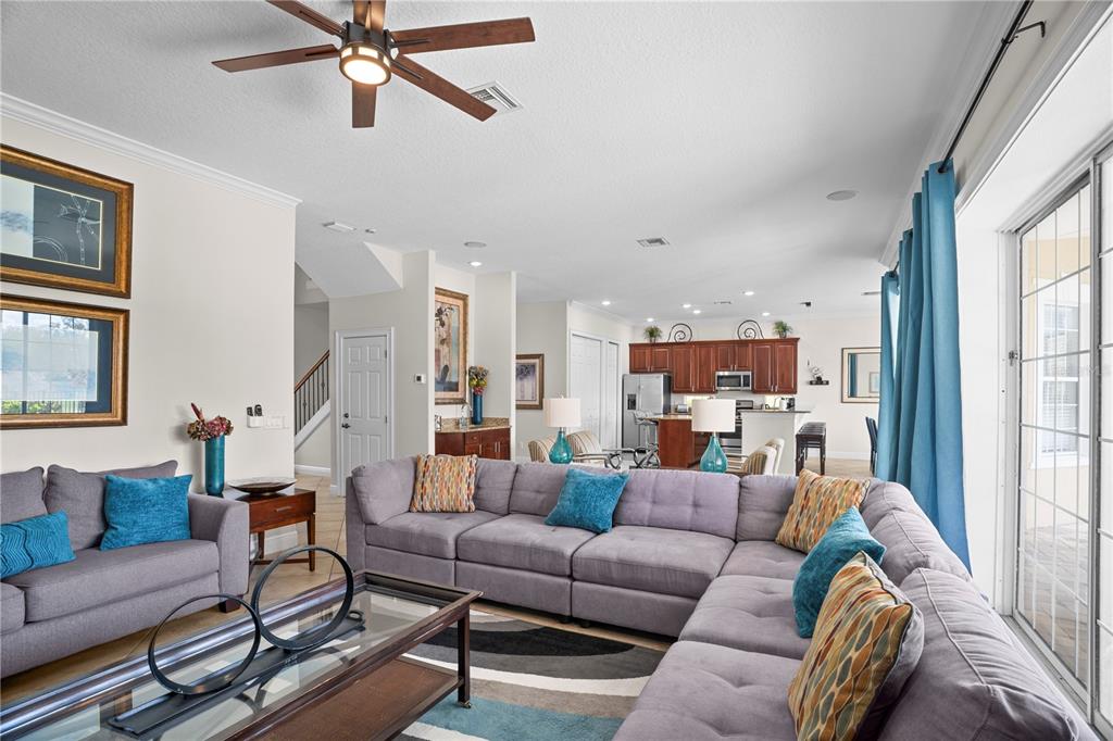 7388 Gathering Court Reunion, FL 34747 - Photo 8 of 56 a living room with furniture and a large window