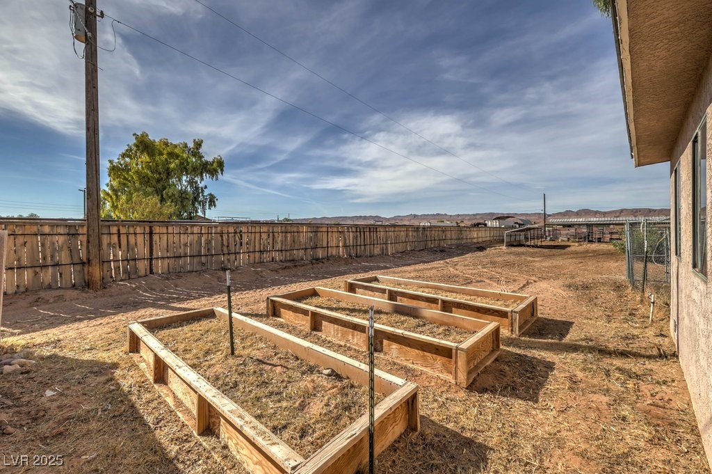 3811 Skyline Street Logandale, NV 89021 - Photo 39 of 58 Fenced backyard with a vegetable garden