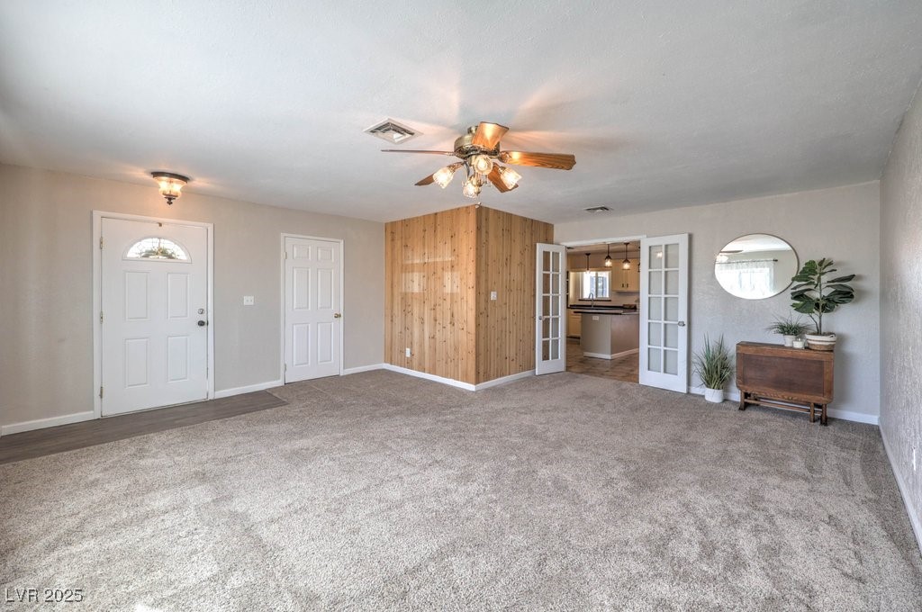 3811 Skyline Street Logandale, NV 89021 - Photo 5 of 58 Living room with French doors that open up to the kitchen and dining area