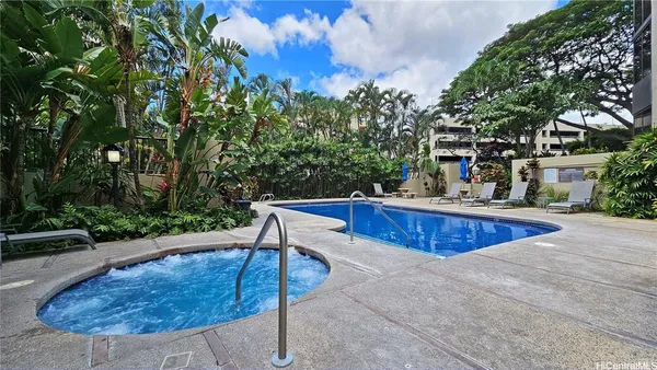 a view of a swimming pool with a patio