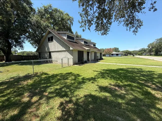 a house with swimming pool in front of it