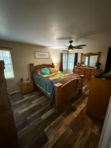 a bedroom with two beds and painted walls