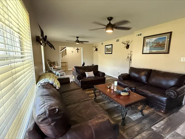 a living room with furniture and a window