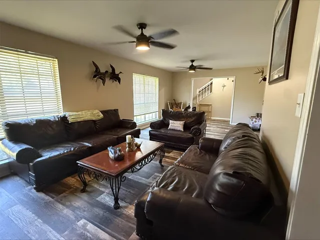a living room with furniture and a window