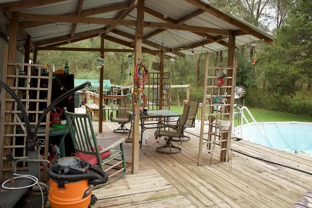 a bedroom with bed and a chandelier