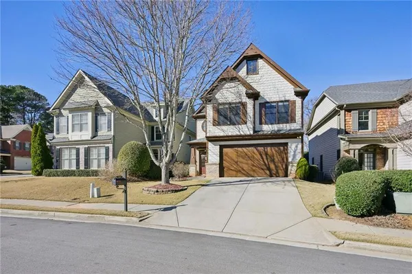 a front view of a house with a yard