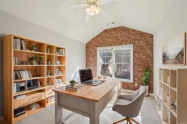 a view of a workspace with furniture