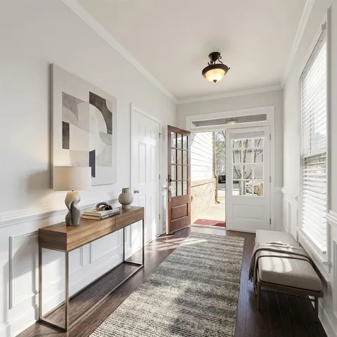 a bedroom with furniture and a window