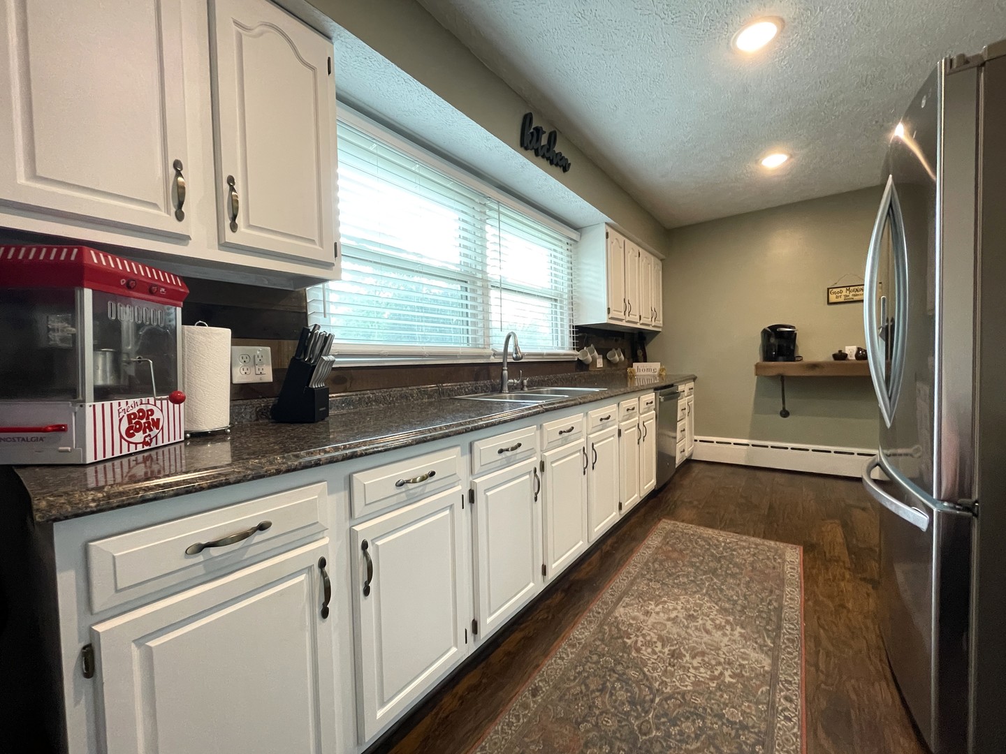 1608 Chevy Chase Drive Champaign, IL 61821 - Photo 13 of 53 a kitchen with stainless steel appliances granite countertop a sink and cabinets
