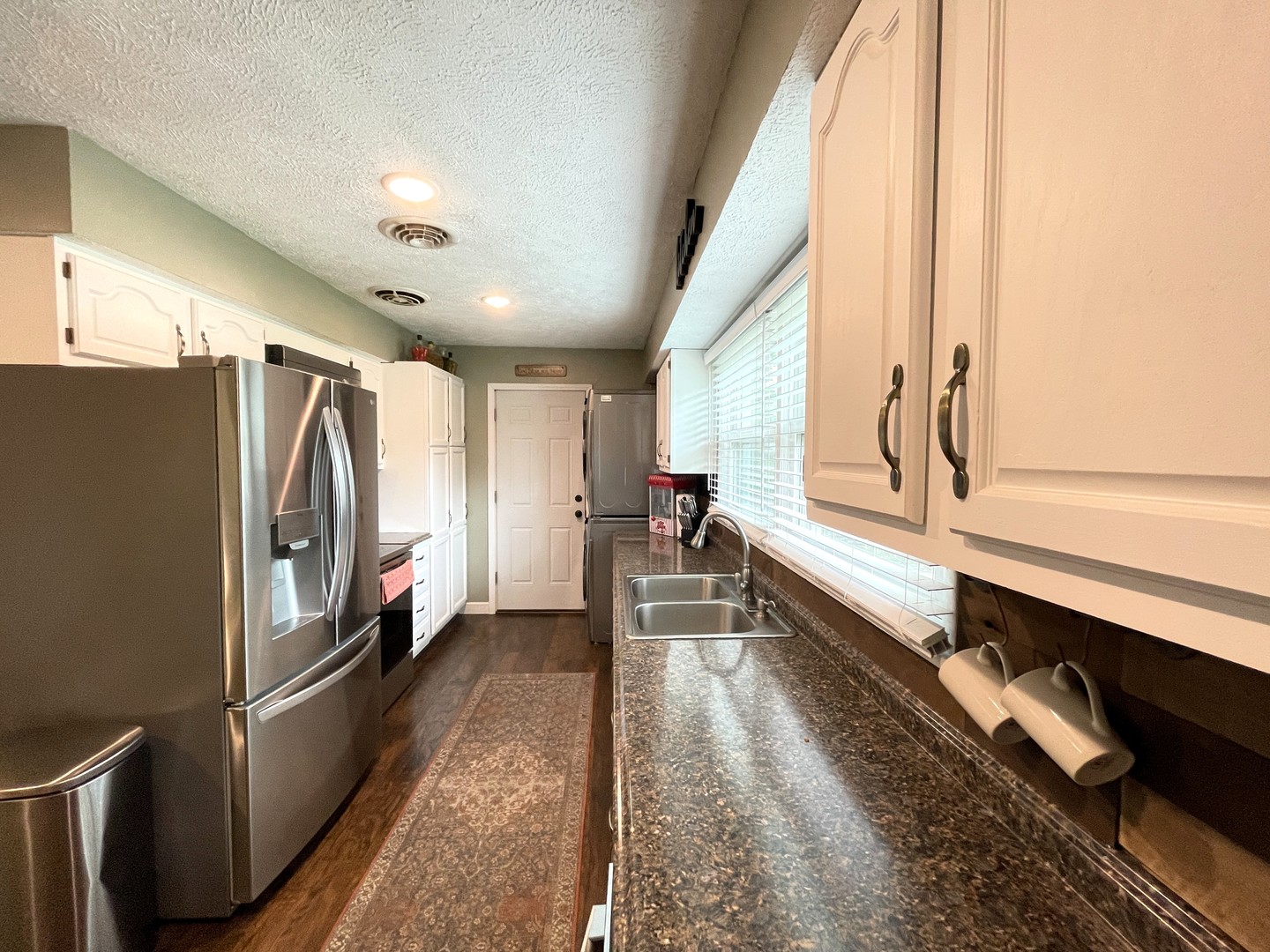 1608 Chevy Chase Drive Champaign, IL 61821 - Photo 16 of 53 a kitchen with stainless steel appliances granite countertop a refrigerator and a stove