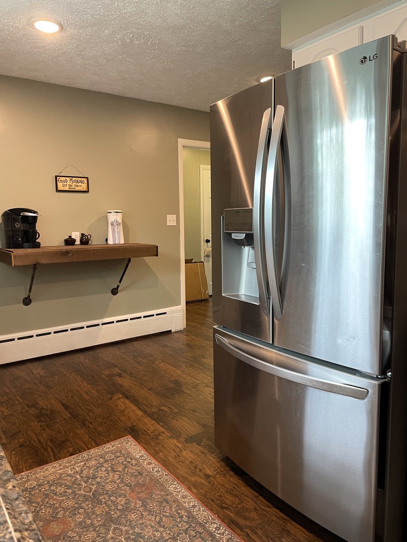1608 Chevy Chase Drive Champaign, IL 61821 - Photo 18 of 53 a view of a refrigerator in kitchen and stainless steel appliances