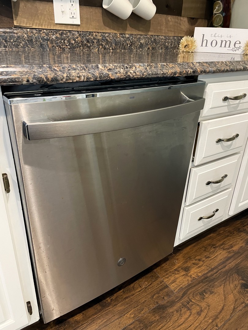 1608 Chevy Chase Drive Champaign, IL 61821 - Photo 20 of 53 a view of a refrigerator in kitchen and wooden floor
