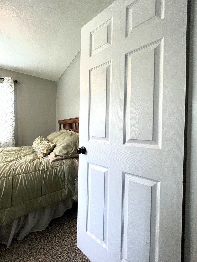 1608 Chevy Chase Drive Champaign, IL 61821 - Photo 34 of 53 a bedroom with a bed and a window