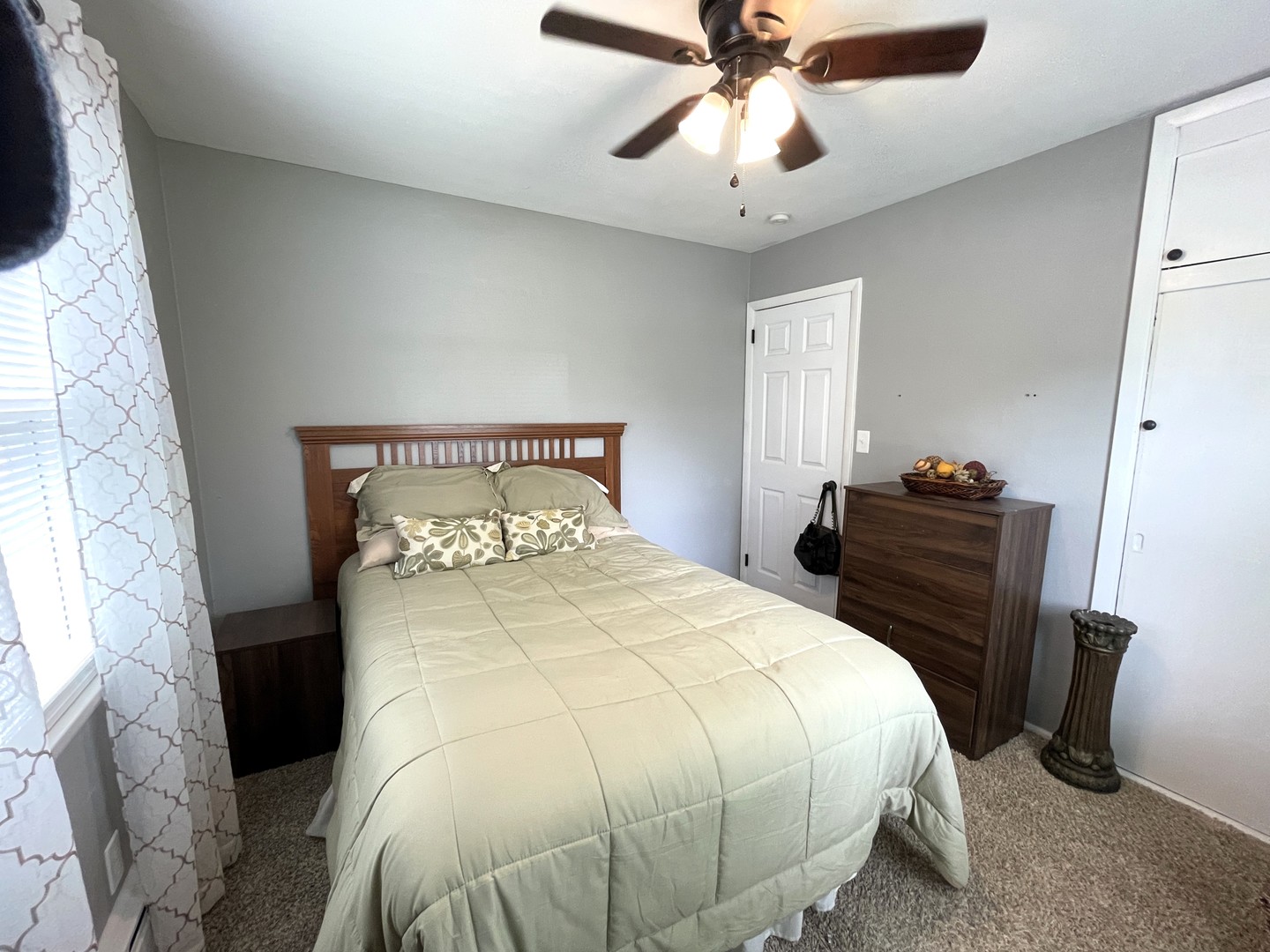1608 Chevy Chase Drive Champaign, IL 61821 - Photo 35 of 53 a bedroom with a bed and a chandelier