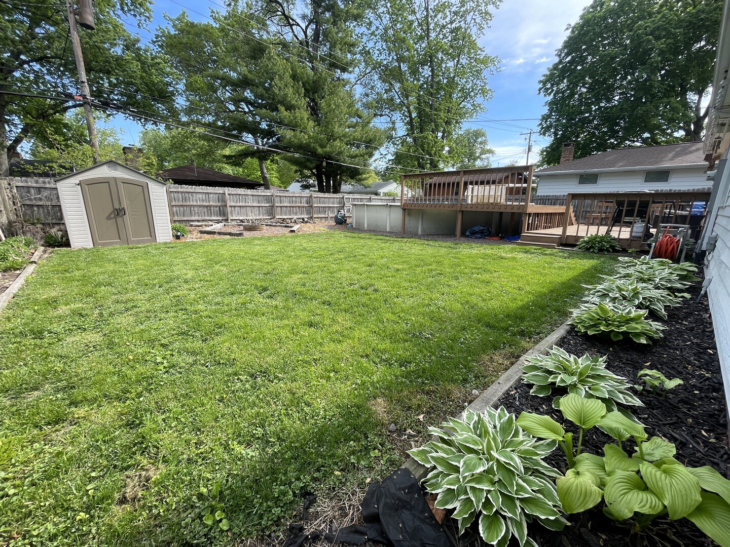 1608 Chevy Chase Drive Champaign, IL 61821 - Photo 44 of 53 a view of a backyard with a garden