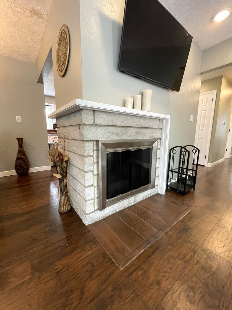 1608 Chevy Chase Drive Champaign, IL 61821 - Photo 7 of 53 a view of a livingroom with furniture and a fireplace