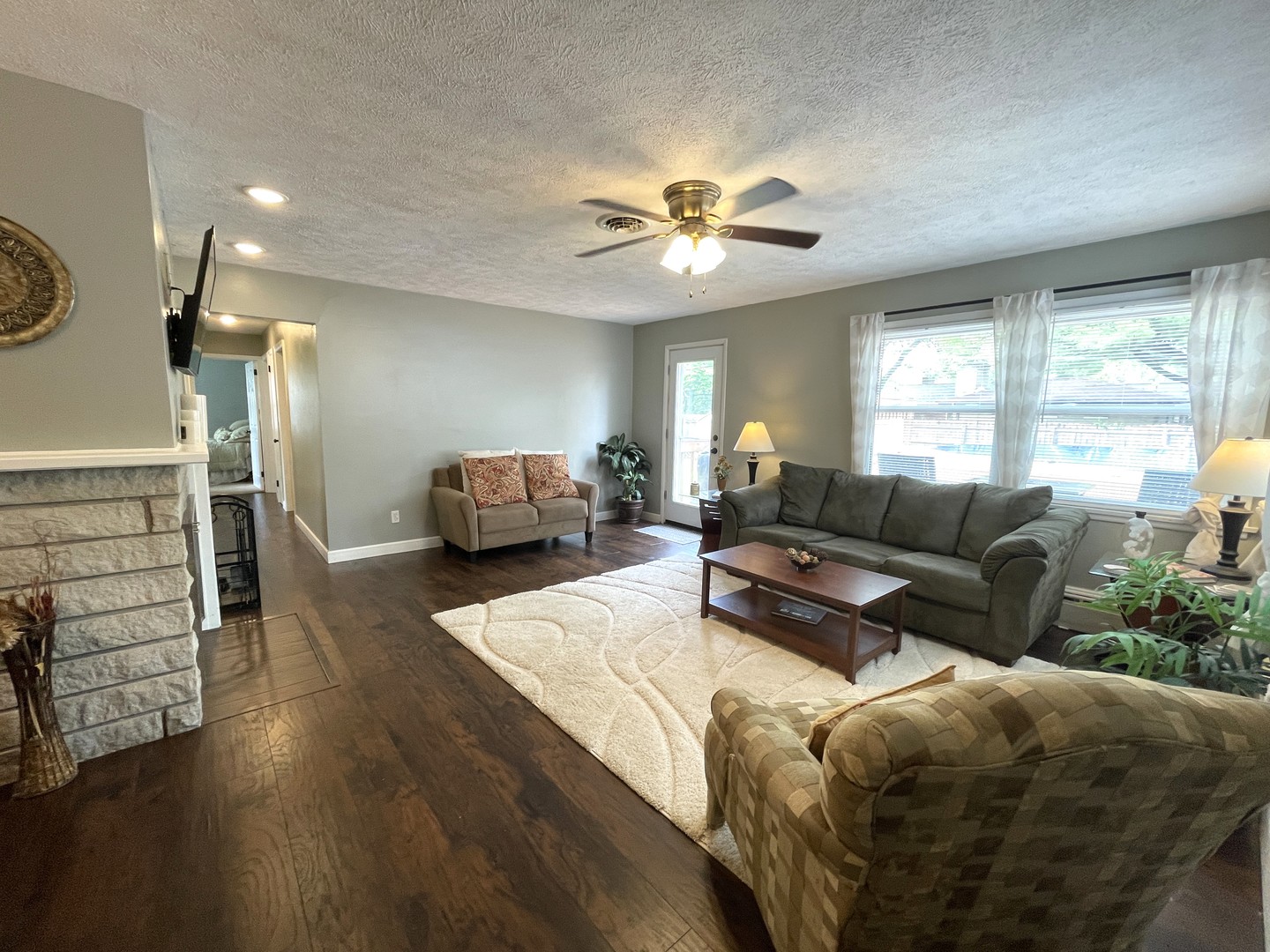 1608 Chevy Chase Drive Champaign, IL 61821 - Photo 10 of 53 a living room with furniture and a flat screen tv