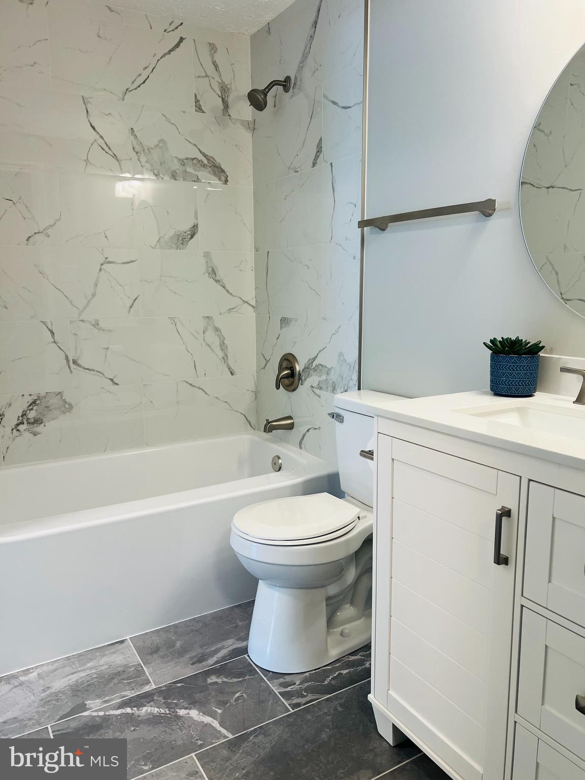 8442 Sugar Creek Lane Springfield, VA 22153 - Photo 17 of 39 a bathroom with a toilet sink and shower
