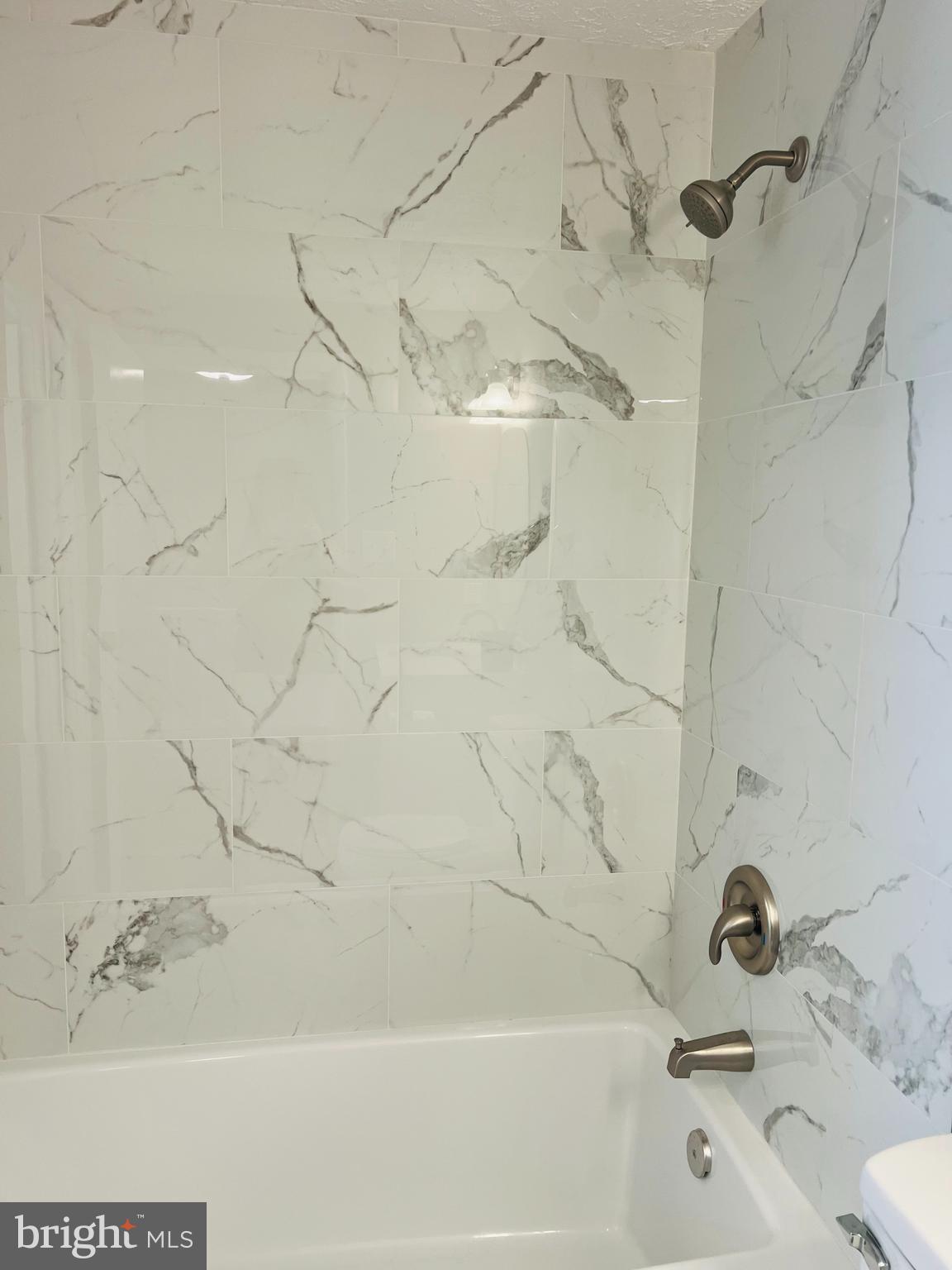 8442 Sugar Creek Lane Springfield, VA 22153 - Photo 18 of 39 a bathroom with a sink and a shower
