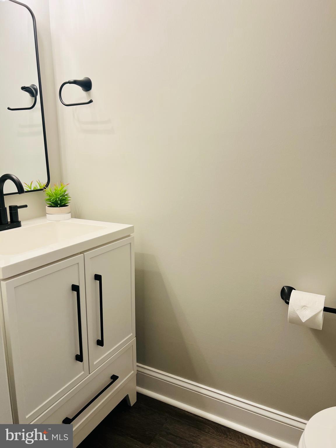 8442 Sugar Creek Lane Springfield, VA 22153 - Photo 28 of 39 a bathroom with a sink toilet and vanity