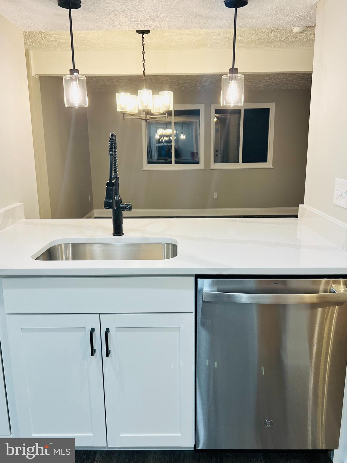 8442 Sugar Creek Lane Springfield, VA 22153 - Photo 3 of 39 a view kitchen living room with a sink and chandelier